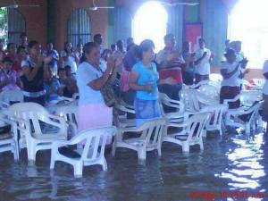 Philippine Christians gather to worship after a devastating typhoon in November 2013